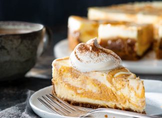Marbled Pumpkin Spice Cheesecake pumpkin spice cheesecake slice on plate