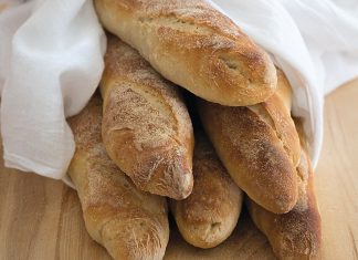 Sourdough Baguettes Sourdough Baguettes together on cutting board baking recipe