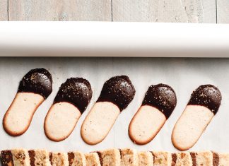 Langues de Chat Langues de Chat dipped in chocolate on parchment