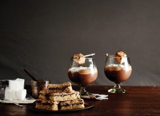 Happy Hour Hot Chocolate Dream Bars stacked on plate on wooden table
