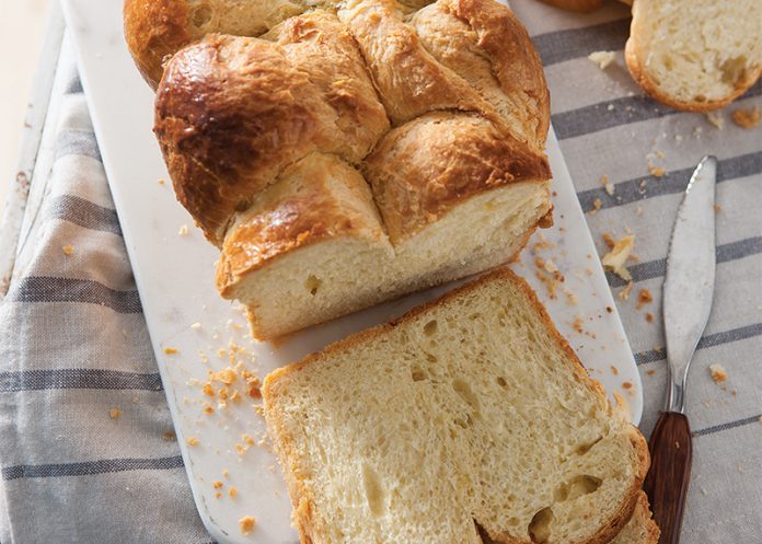 Bubble-Top Brioche Loaf sliced on marble baking recipe