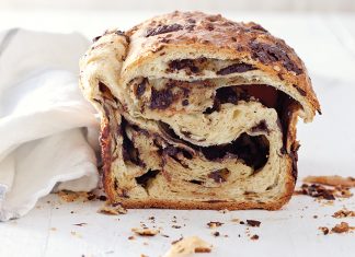 Brioche au Chocolat Loaf Brioche au Chocolat Loaf on white surface sliced