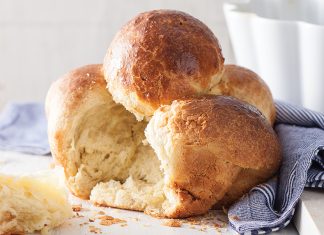 Brioche à Tête Brioche à Tête on white surface torn into baking recipe