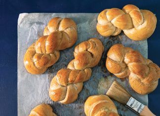 Pretzel Twists Pretzel Twists on parchment on blue surface baking recipe