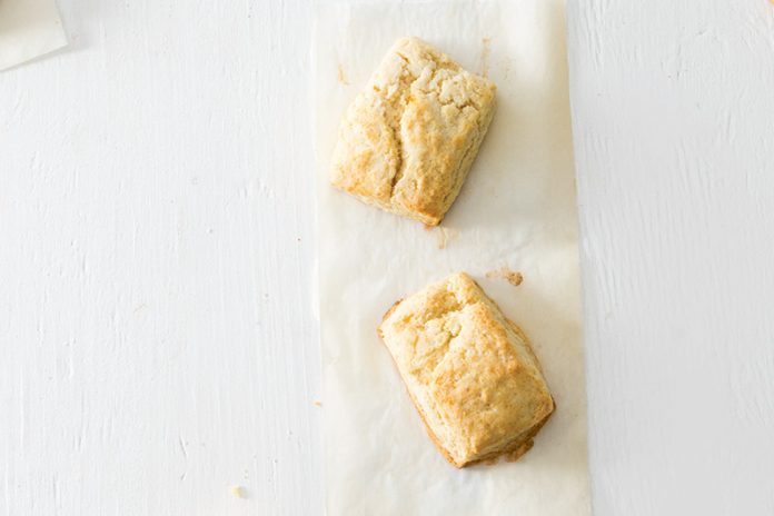 Gougères with champagne on white