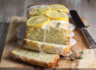 Our Best Recipes of 2019 Glazed Lemon-Thyme Poppy Seed Cake sliced on cutting board