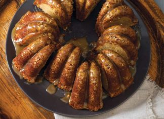 Pecan Bundt Cake Pecan Pie Bundt sliced on black plate