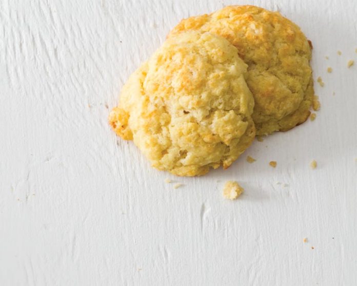 Gougères with champagne on white