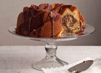 Peanut Butter and Chocolate Swirl Bundt Cake Peanut Butter and Chocolate Swirl Bundt Cake sliced on glass cake stand