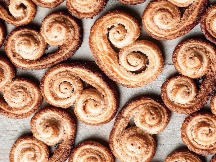 Palmiers with Vanilla Bean, Pecan, and Cardamom on parchment