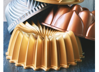 The Art of “Bundting”: How Four Friends Bonded Over Our Bundt of the Month Club Bros that Bundt Bundt of the month stack of Bundt pans