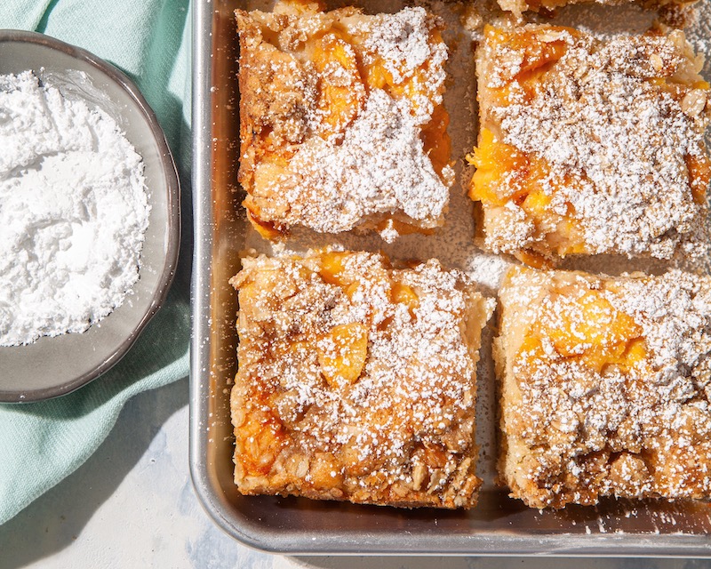 Peach Streusel Snack Cake sliced in pan