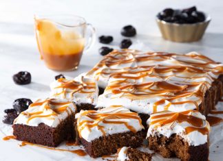 Sticky Toffee Pudding Prune Squares Sticky Toffee Pudding Prune Squares cut on parchment with caramel drizzle