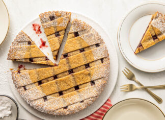Baking School In-Depth: Linzer Torte Linzer torte overhead angle on marble surface.