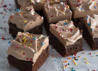Chocolate Snack Cake Chocolate Snack Cake sliced on glass plate on marble surface