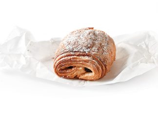 Pain au Chocolat where to find the best Pain au Chocolat bakeries. Pain au chocolate on white parchment