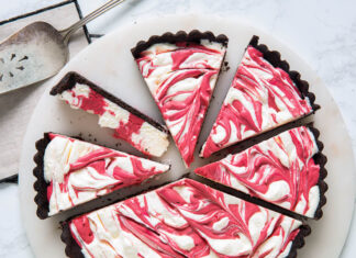 Red Velvet Cheesecake Tart red velvet cheesecake tart sliced on marble