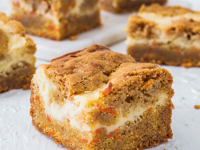 Carrot Cake Cheesecake Bars on Parchment