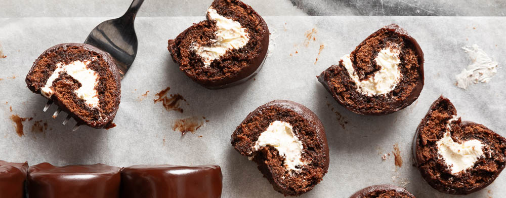 Swiss Cake Rolls on Parchment on Marble