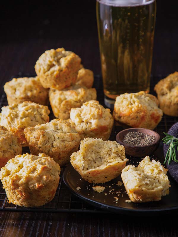 Beer-Cheddar Muffins on Black Plate with Beer Glass 