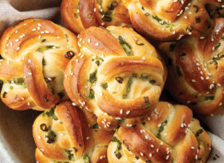 Sesame-and-Green Onion Knots Sesame-and-Green Onion Knots in bowl with linen napkin on marble