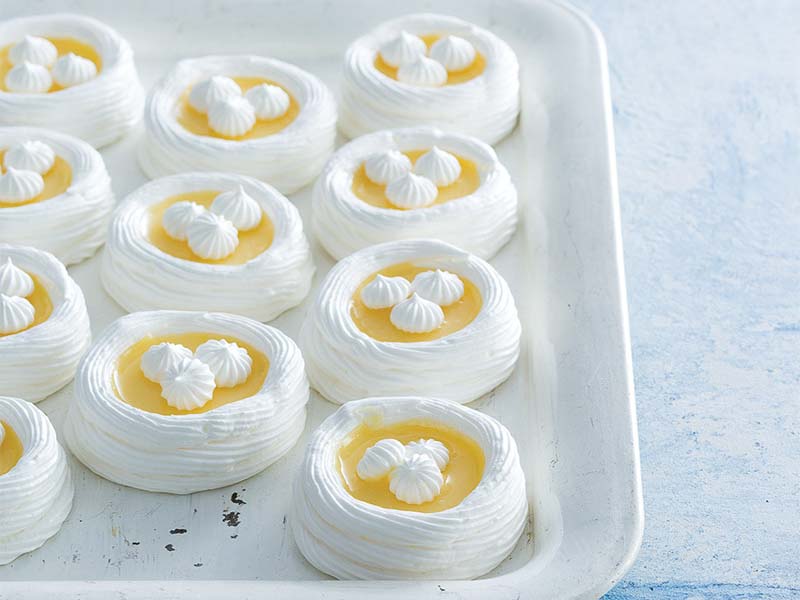 Lemon Meringue Nests on Parchment on Baking Tray