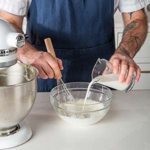 Mixing ingredients in glass mixing bowl