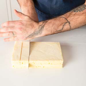 Cutting stacked cake layers in petit fours