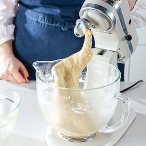 Dough on dough hook in mixing bowl