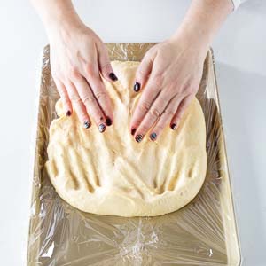 Spread dough on baking sheet