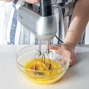 Mixing eggs with hand mixer