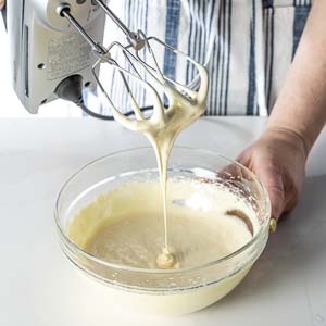 Mixing egg mixture with hand mixer