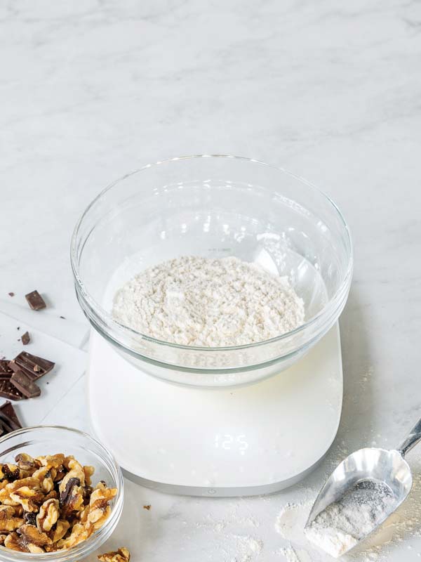 Weighing ingredients on kitchen scale