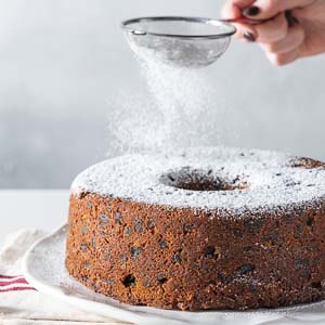 Sprinkling sugar on the cake