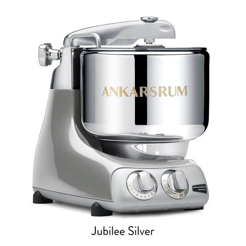 Stand mixer in Jubilee Silver with chrome finish and control dials on the base.