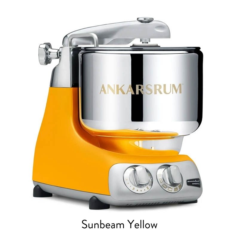 Yellow Ankarsrum stand mixer with chrome bowl and control dials, ready for baking