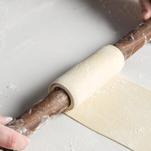 rolling dough with rolling pin