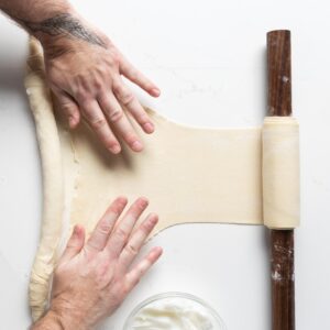 rolling dough on rolling pin