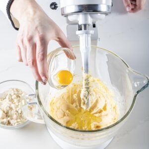 adding egg to mixer