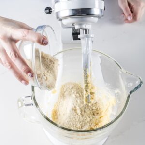 adding ingredients to mixer