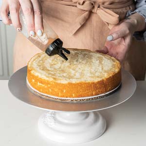 Adding vanilla simple syrup to cake layers