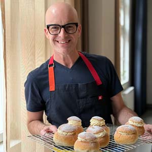 Brian Hart Hoffman holding semlor