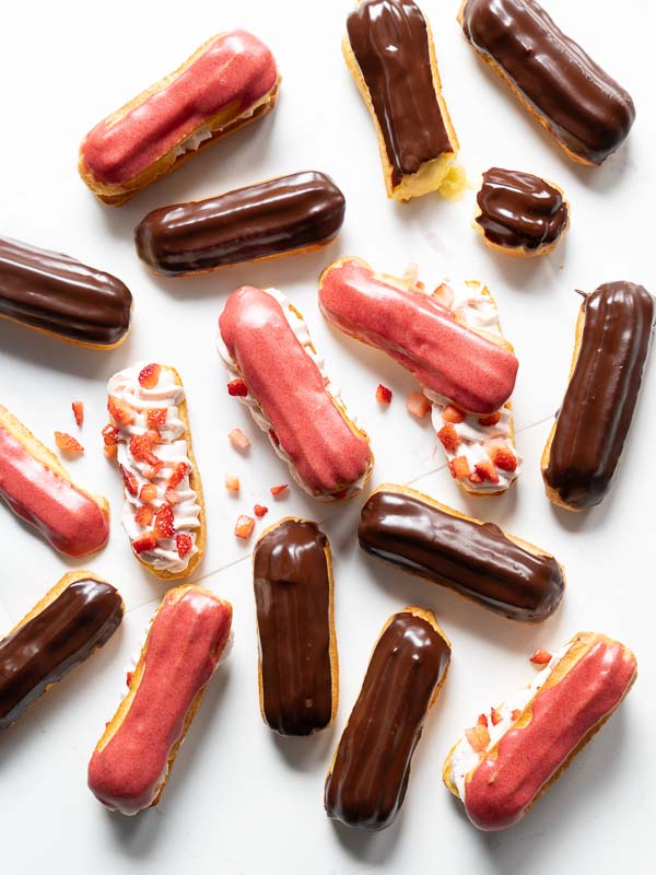 Eclairs scattered on table