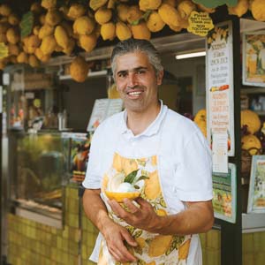Guy holding lemons
