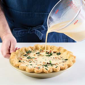 Adding filling to quiche