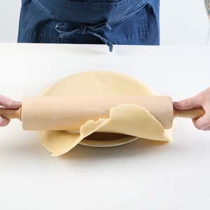 Adding dough to pie plate