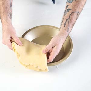 Folding dough into pie plate