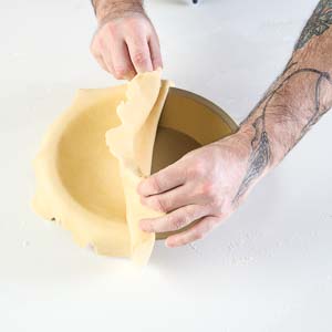 Putting dough in pie plate