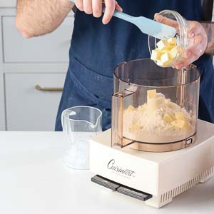 Adding butter to food processor 
