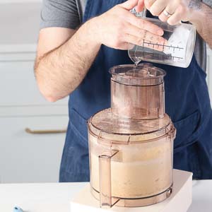 Adding water to food processor